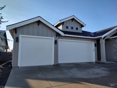 This incredible home features a beautiful kitchen with quartz on Hunters Point Golf Club in Idaho - for sale on GolfHomes.com, golf home, golf lot