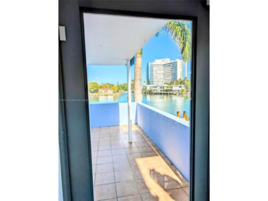 NOT a condo, NO huge assessments! Comes with a rare PRIVATE boat on Normandy Shores Golf Course in Florida - for sale on GolfHomes.com, golf home, golf lot