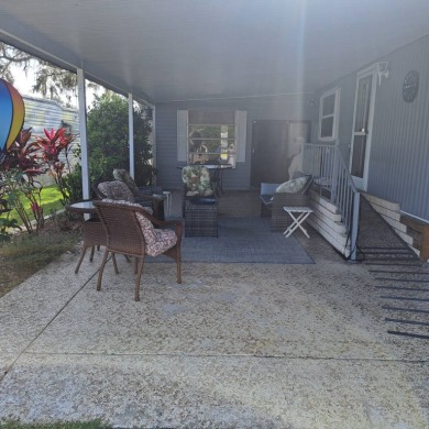 NEW LOW PRICE!!  GREAT VALUE!!  Located in an all age RV resort on Southport Springs Golf Club in Florida - for sale on GolfHomes.com, golf home, golf lot