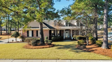 One level home situated on a lot backing to the golf course and on Magnolia Greens Golf Plantation in North Carolina - for sale on GolfHomes.com, golf home, golf lot