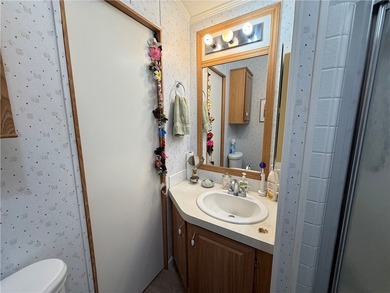 2 bedroom 1 bath with covered deck and parking. Newly remodeled on Riverview Golf Course in Arizona - for sale on GolfHomes.com, golf home, golf lot