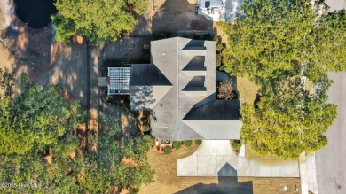 One level home situated on a lot backing to the golf course and on Magnolia Greens Golf Plantation in North Carolina - for sale on GolfHomes.com, golf home, golf lot