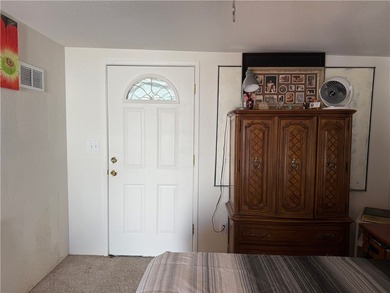 2 bedroom 1 bath with covered deck and parking. Newly remodeled on Riverview Golf Course in Arizona - for sale on GolfHomes.com, golf home, golf lot