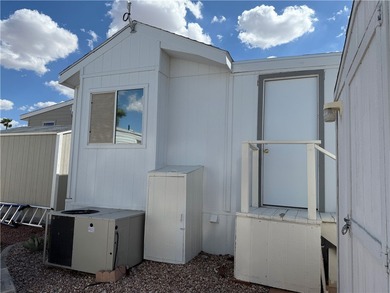 2 bedroom 1 bath with covered deck and parking. Newly remodeled on Riverview Golf Course in Arizona - for sale on GolfHomes.com, golf home, golf lot