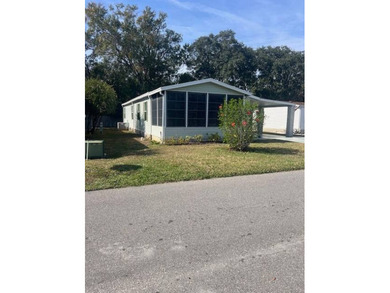 Well-priced, spacious home in a beautiful setting at The on Hamptons Golf Club in Florida - for sale on GolfHomes.com, golf home, golf lot