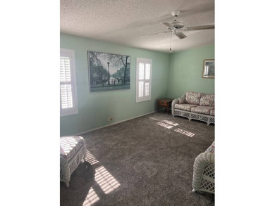 Well-priced, spacious home in a beautiful setting at The on Hamptons Golf Club in Florida - for sale on GolfHomes.com, golf home, golf lot