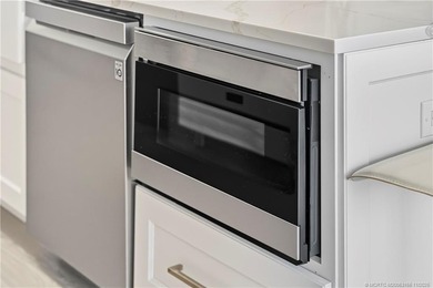 Beautifully updated 4BR/3.5BA CBS home on 1 acre in the gated on Evergreen Club in Florida - for sale on GolfHomes.com, golf home, golf lot