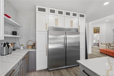 Beautifully updated 4BR/3.5BA CBS home on 1 acre in the gated on Evergreen Club in Florida - for sale on GolfHomes.com, golf home, golf lot