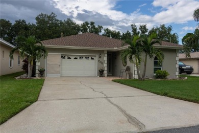 Welcome to this charming 3 bedroom, 3 bath pool home nestled in on Cypresswood Golf and Country Club in Florida - for sale on GolfHomes.com, golf home, golf lot