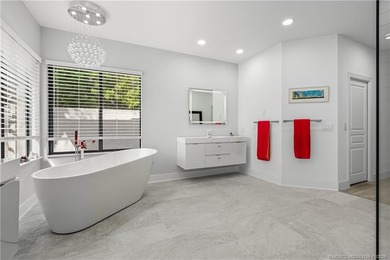 Beautifully updated 4BR/3.5BA CBS home on 1 acre in the gated on Evergreen Club in Florida - for sale on GolfHomes.com, golf home, golf lot