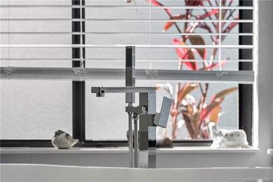 Beautifully updated 4BR/3.5BA CBS home on 1 acre in the gated on Evergreen Club in Florida - for sale on GolfHomes.com, golf home, golf lot