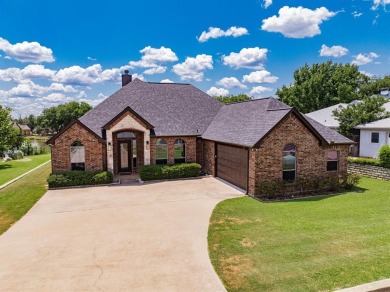 BEAUTIFUL STONE AND BRICK HOME on the par 3, 14th hole of the on Pecan Plantation Country Club in Texas - for sale on GolfHomes.com, golf home, golf lot