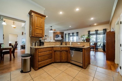 BEAUTIFUL STONE AND BRICK HOME on the par 3, 14th hole of the on Pecan Plantation Country Club in Texas - for sale on GolfHomes.com, golf home, golf lot