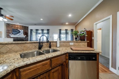 BEAUTIFUL STONE AND BRICK HOME on the par 3, 14th hole of the on Pecan Plantation Country Club in Texas - for sale on GolfHomes.com, golf home, golf lot