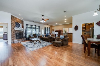 BEAUTIFUL STONE AND BRICK HOME on the par 3, 14th hole of the on Pecan Plantation Country Club in Texas - for sale on GolfHomes.com, golf home, golf lot
