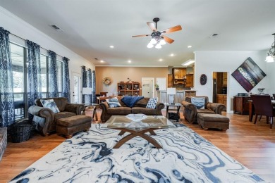BEAUTIFUL STONE AND BRICK HOME on the par 3, 14th hole of the on Pecan Plantation Country Club in Texas - for sale on GolfHomes.com, golf home, golf lot