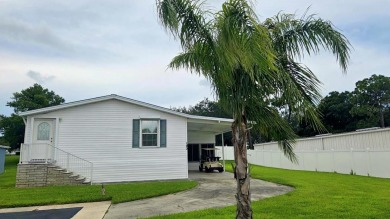 Resort-style living with everything included!  Live steps from on Tarpon Springs Golf Course in Florida - for sale on GolfHomes.com, golf home, golf lot