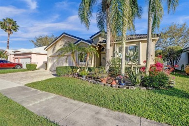 This spacious 1-story home offers serene water views from nearly on Woodmont Country Club in Florida - for sale on GolfHomes.com, golf home, golf lot