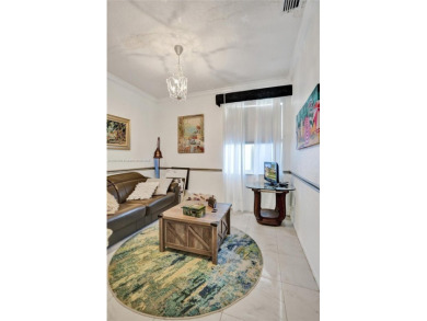 This spacious 1-story home offers serene water views from nearly on Woodmont Country Club in Florida - for sale on GolfHomes.com, golf home, golf lot