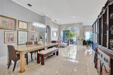 This spacious 1-story home offers serene water views from nearly on Woodmont Country Club in Florida - for sale on GolfHomes.com, golf home, golf lot