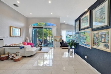 This spacious 1-story home offers serene water views from nearly on Woodmont Country Club in Florida - for sale on GolfHomes.com, golf home, golf lot
