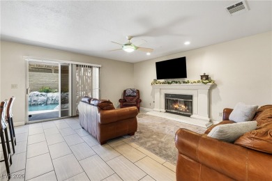This stunning two-story residence offers 5 spacious bedrooms and on Painted Desert Golf Club in Nevada - for sale on GolfHomes.com, golf home, golf lot