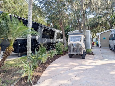 Whether looking for a winter retreat or a full-time residence on The Great Outdoors Golf and Country Club in Florida - for sale on GolfHomes.com, golf home, golf lot
