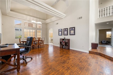 This stunning two-story residence offers 5 spacious bedrooms and on Painted Desert Golf Club in Nevada - for sale on GolfHomes.com, golf home, golf lot