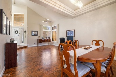 This stunning two-story residence offers 5 spacious bedrooms and on Painted Desert Golf Club in Nevada - for sale on GolfHomes.com, golf home, golf lot