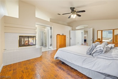 This stunning two-story residence offers 5 spacious bedrooms and on Painted Desert Golf Club in Nevada - for sale on GolfHomes.com, golf home, golf lot