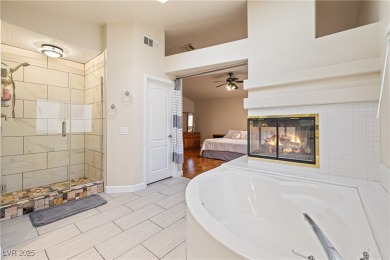This stunning two-story residence offers 5 spacious bedrooms and on Painted Desert Golf Club in Nevada - for sale on GolfHomes.com, golf home, golf lot