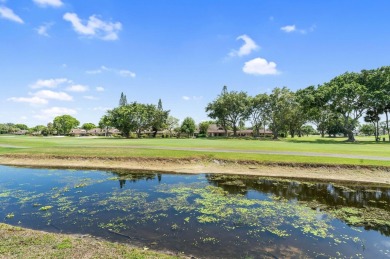 Wake up to tranquil lake and golf course views in this on Fountains Golf and Country Club in Florida - for sale on GolfHomes.com, golf home, golf lot