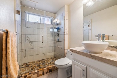 This stunning two-story residence offers 5 spacious bedrooms and on Painted Desert Golf Club in Nevada - for sale on GolfHomes.com, golf home, golf lot