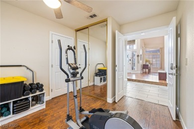 This stunning two-story residence offers 5 spacious bedrooms and on Painted Desert Golf Club in Nevada - for sale on GolfHomes.com, golf home, golf lot