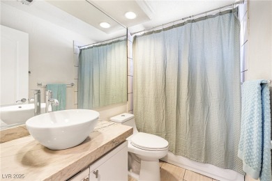 This stunning two-story residence offers 5 spacious bedrooms and on Painted Desert Golf Club in Nevada - for sale on GolfHomes.com, golf home, golf lot