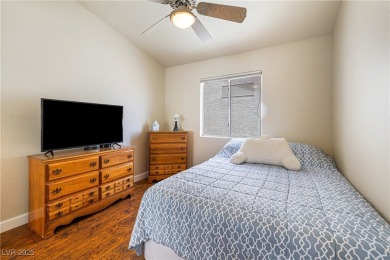 This stunning two-story residence offers 5 spacious bedrooms and on Painted Desert Golf Club in Nevada - for sale on GolfHomes.com, golf home, golf lot