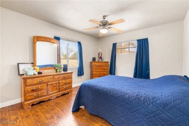 This stunning two-story residence offers 5 spacious bedrooms and on Painted Desert Golf Club in Nevada - for sale on GolfHomes.com, golf home, golf lot