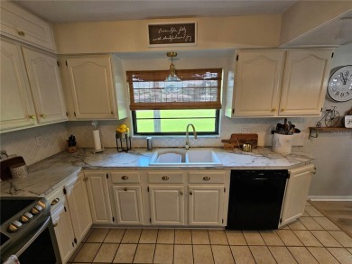 **Charming 3-Bedroom Home in Gated Cypresswood Community** 

 on Cypresswood Golf and Country Club in Florida - for sale on GolfHomes.com, golf home, golf lot