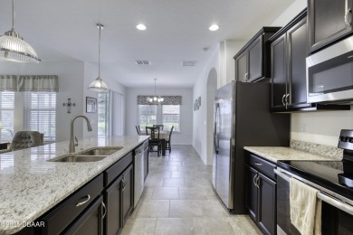 Welcome to this stunning and furnished 4-bedroom, 3-bathroom on LPGA International Golf Course in Florida - for sale on GolfHomes.com, golf home, golf lot