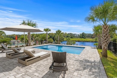 Welcome to 496 West Palms, a breathtaking waterfront sanctuary on Myrtlewood Golf Course and Club  in South Carolina - for sale on GolfHomes.com, golf home, golf lot