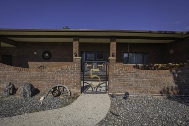 Step into this charming, expansive one-story brick home nestled on Olive Glenn Golf and Country Club in Wyoming - for sale on GolfHomes.com, golf home, golf lot
