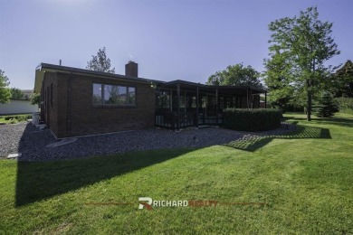Step into this charming, expansive one-story brick home nestled on Olive Glenn Golf and Country Club in Wyoming - for sale on GolfHomes.com, golf home, golf lot