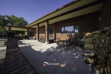 Step into this charming, expansive one-story brick home nestled on Olive Glenn Golf and Country Club in Wyoming - for sale on GolfHomes.com, golf home, golf lot