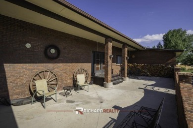 Step into this charming, expansive one-story brick home nestled on Olive Glenn Golf and Country Club in Wyoming - for sale on GolfHomes.com, golf home, golf lot
