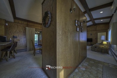 Step into this charming, expansive one-story brick home nestled on Olive Glenn Golf and Country Club in Wyoming - for sale on GolfHomes.com, golf home, golf lot