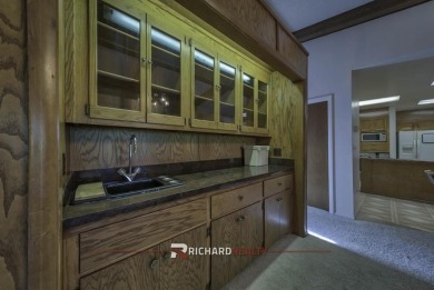 Step into this charming, expansive one-story brick home nestled on Olive Glenn Golf and Country Club in Wyoming - for sale on GolfHomes.com, golf home, golf lot
