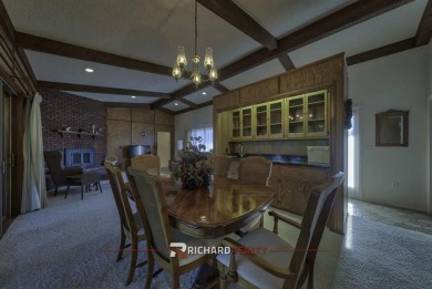 Step into this charming, expansive one-story brick home nestled on Olive Glenn Golf and Country Club in Wyoming - for sale on GolfHomes.com, golf home, golf lot