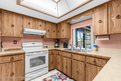 Welcome home to this charming and METICULOUSLY maintained on Oak Hills Country Club in Florida - for sale on GolfHomes.com, golf home, golf lot