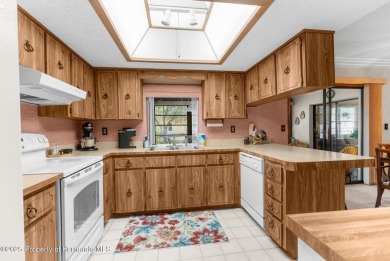 Welcome home to this charming and METICULOUSLY maintained on Oak Hills Country Club in Florida - for sale on GolfHomes.com, golf home, golf lot