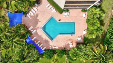Experience island living at its finest! This spacious 2/2 condo on Ocean Club At the Hutchinson Island Beach Resort in Florida - for sale on GolfHomes.com, golf home, golf lot